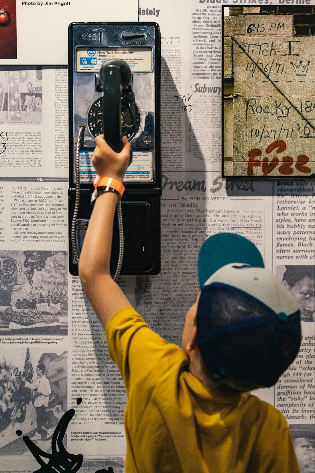 boy holding black telephone