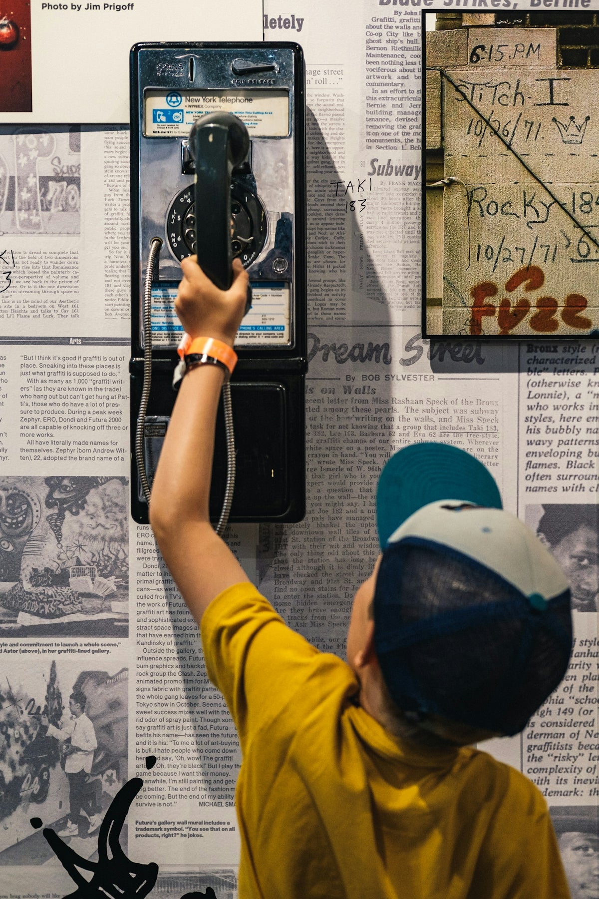 boy holding black telephone