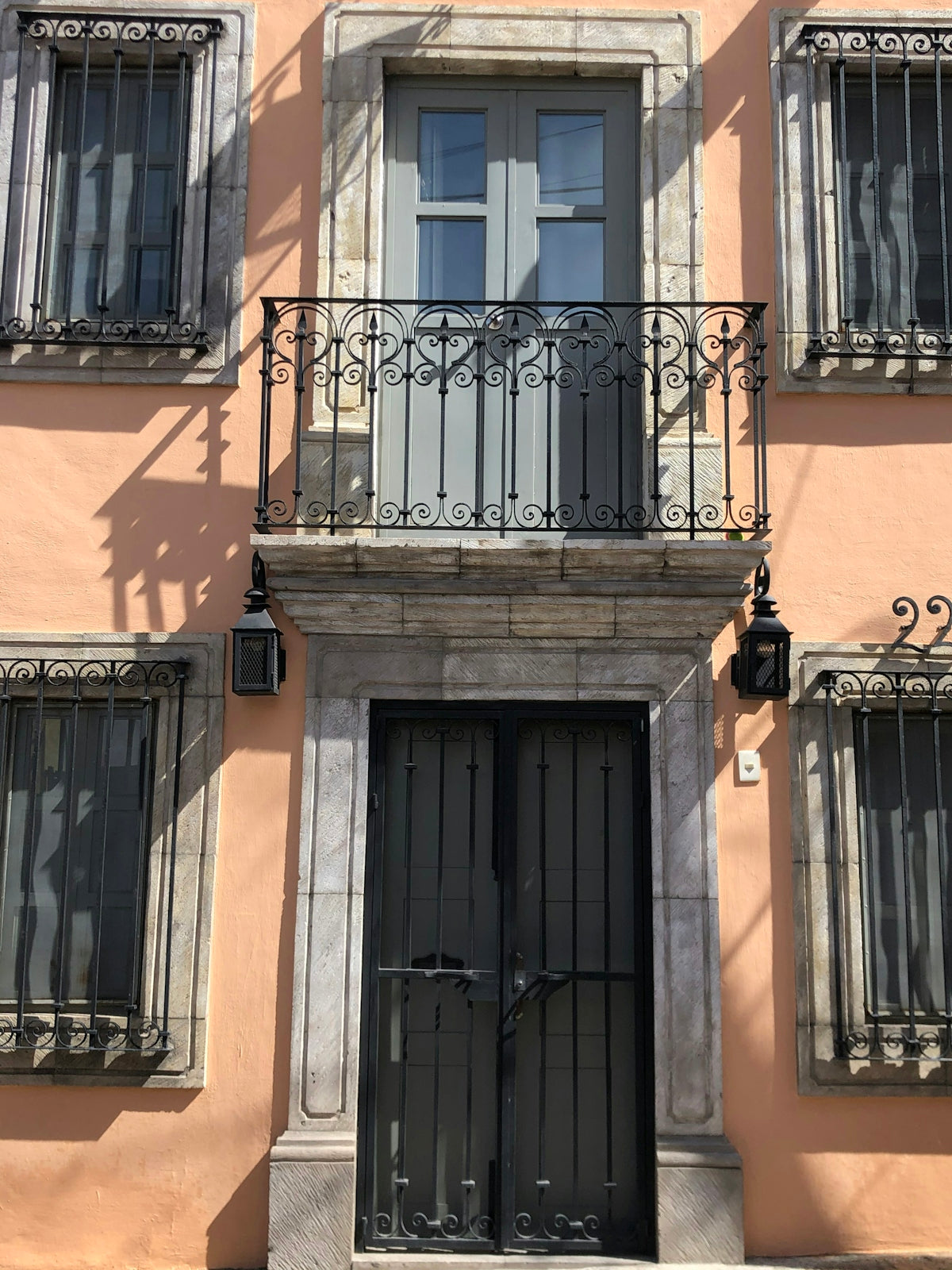 black wooden door on brown concrete building