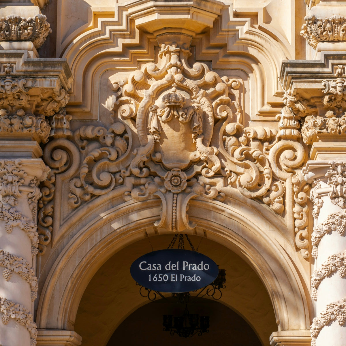 Ornate architectural detail above casa del prado entrance