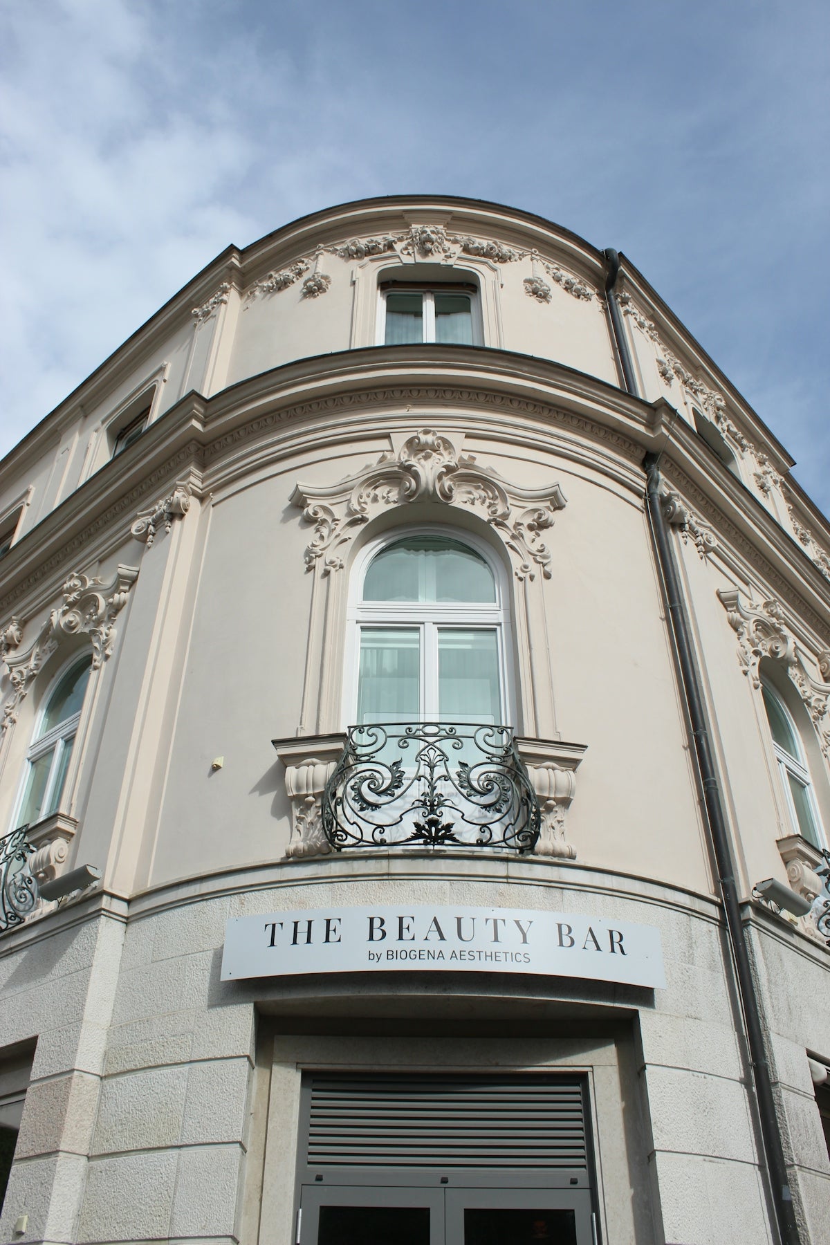 Ornate corner building with 'the beauty bar' sign.