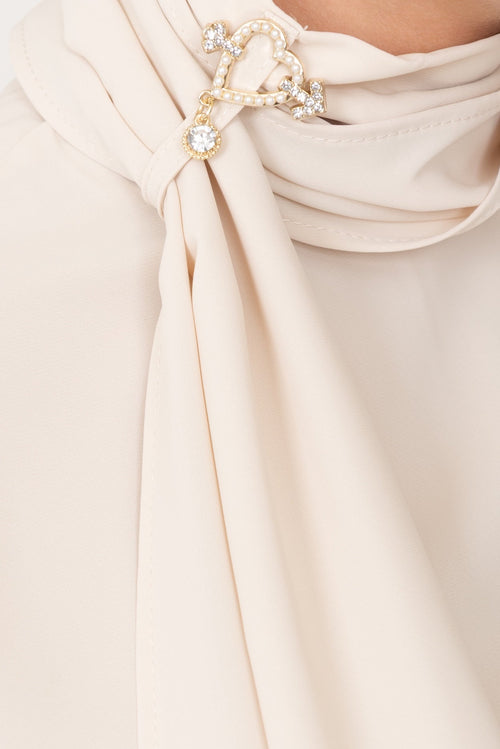 Blouse with No-nà accessory for an elegant and fashionable look