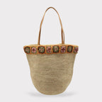 Flora - Borsa in rafia intrecciata fatta a mano con fiore in ambra all'uncinetto